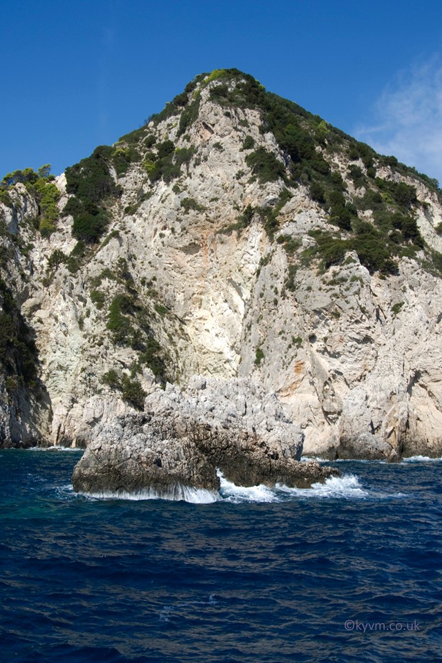 Blues, whites and greens. An imposing cliff with an out of reach peak.  You can conjure ancient Greek myth happening in this picture.